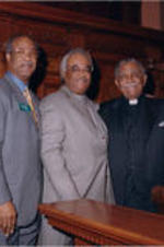 From left to right, an unidentified man, Calvin Smyre, Tyrone Brooks, Joseph E. Lowery, and Terry Coleman pose for a photo in the chamber for the Georgia House of Representatives.