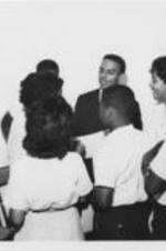 Andrew Young is shown speaking to a group of students.