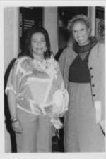 Coretta Scott King is shown with an unidentified woman posing for a picture during a SCLC/W.O.M.E.N. event.