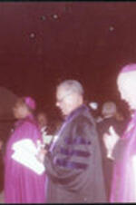 Three Bishops participate in a ceremony.