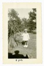 Beth I. Chandler as child on grass. Written on verso: Morehouse campus day.