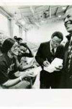 President Hugh Gloster with Alex Haley and students.