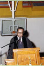 An unidentified faculty member delivers a commencement address to the class of 1979.