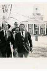 President Hugh Gloster walking with Alex Haley.
