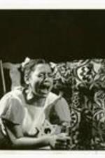 View of unidentified actress on stage crying.
