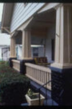 A woman stands on her porch. Text from slide presentation: and wide porches
